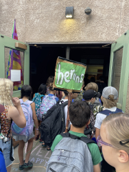 students walking in door