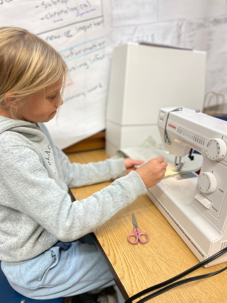 Child at sewing machine